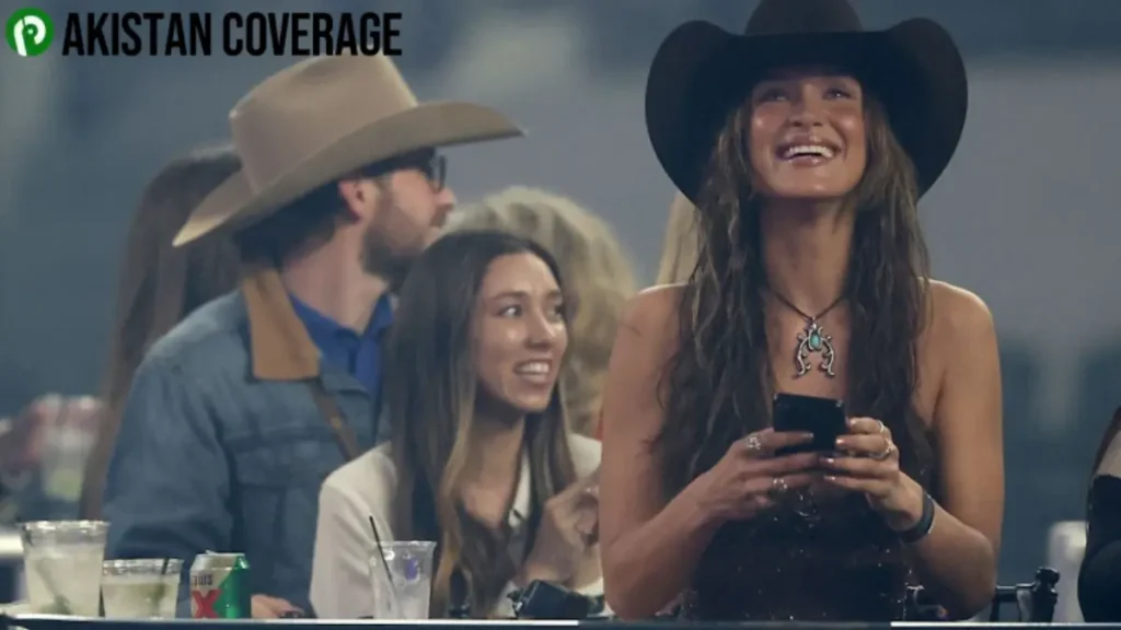 Bella Hadid smiling during a public appearance amid her relationship with cowboy Adan Banuelos.
