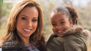Caribe Devine smiling with her daughter, reflecting her role as a successful journalist and devoted mother.