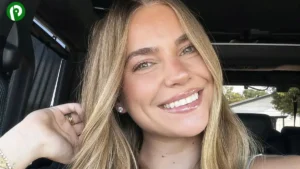 Emilie Kiser smiling at camera, blonde hair and earrings, wearing summer attire, social media influencer.