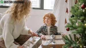 Mother giving a gift to her child, capturing a joyful family moment.