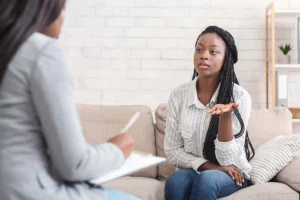 Therapist using tablet in a modern clinic setting to manage client care with digital tools like CentralReach