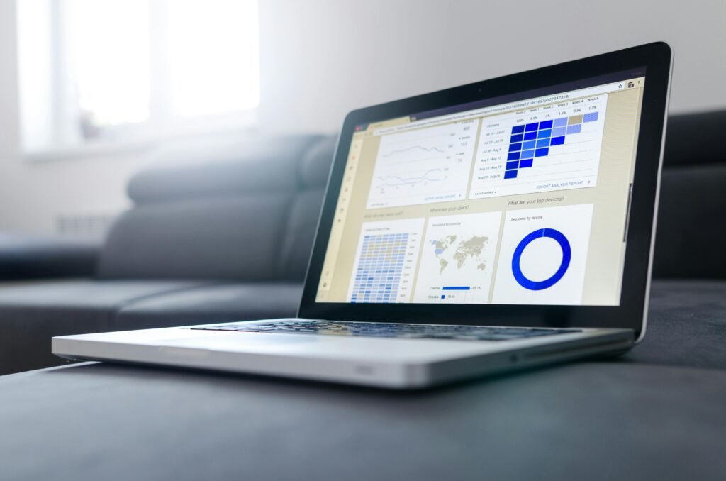 Laptop displaying Voomixi com digital dashboard with AI analytics tools
