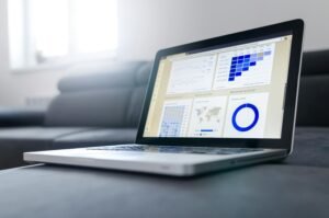 Laptop displaying Voomixi com digital dashboard with AI analytics tools