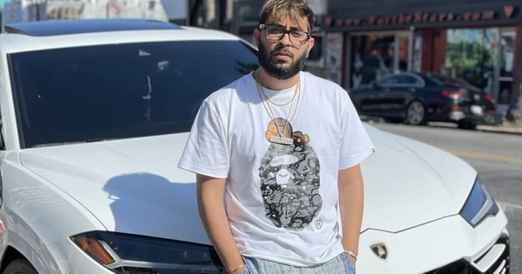 Adeel Shams posing in front of a luxury Lamborghini, showcasing his millionaire lifestyle and $20M net worth success.