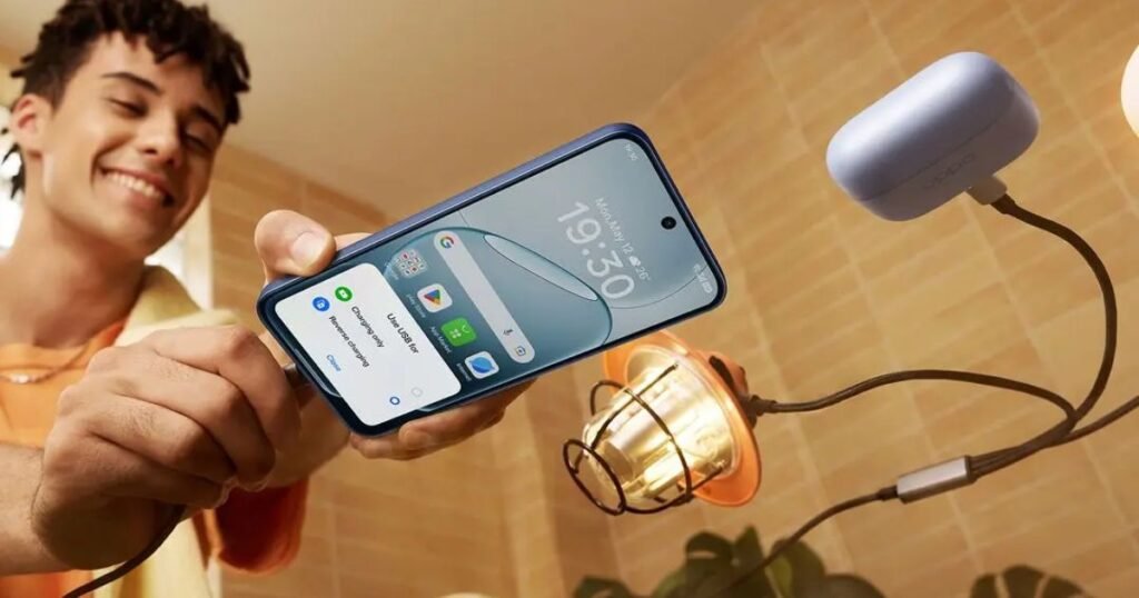 Man happily charging his OPPO A6 Pro smartphone, showcasing fast charging feature.