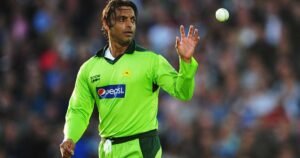 Shoaib Akhtar in Pakistan cricket jersey during a match, holding the ball.