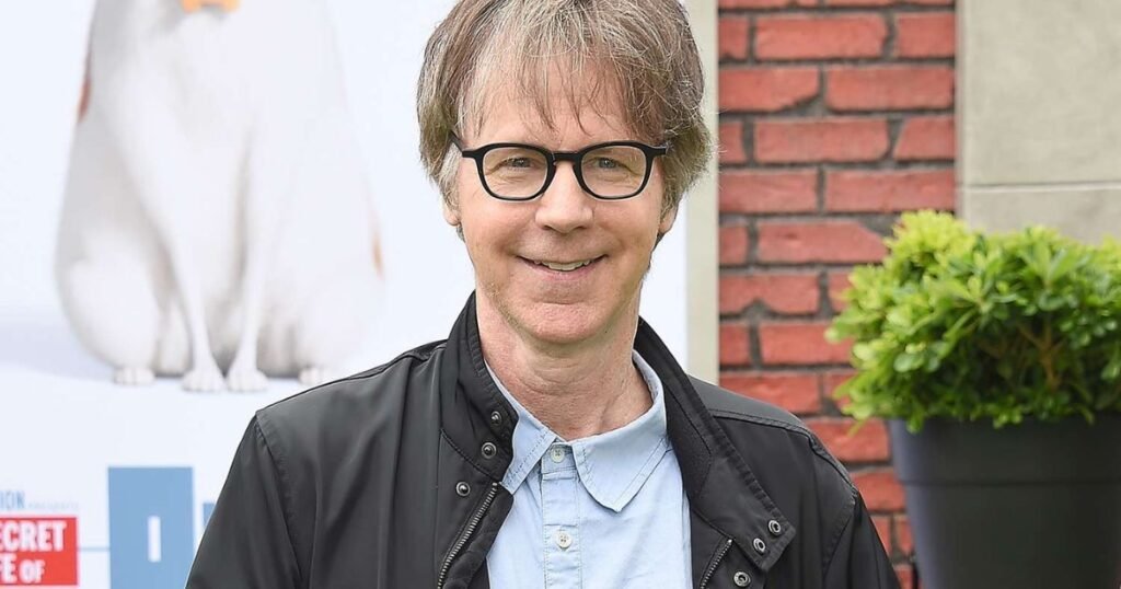 Dana Carvey smiles at a movie premiere event, reflecting his early career in comedy and entertainment.